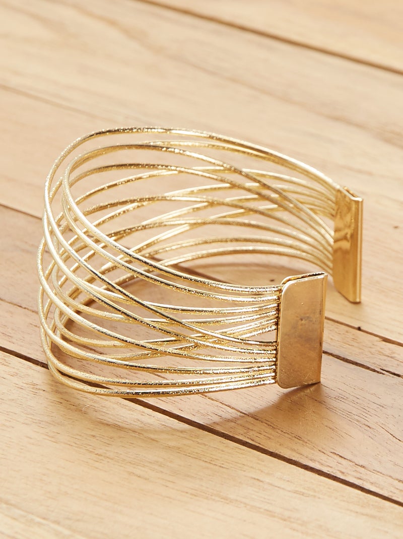 Bracciale rigido martellato in oro massiccio