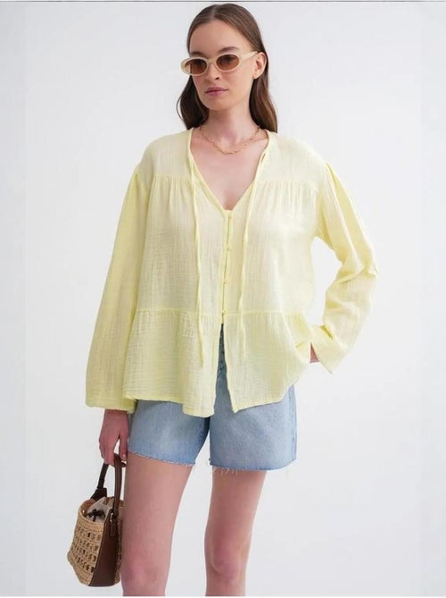 Camicetta a maniche lunghe dalla vestibilità relaxed con fiocco al collo mixray - Kiabi Camicetta a maniche lunghe dalla vestibilità relaxed con fiocco al collo mixray - Kiabi