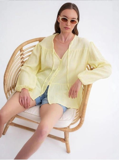Camicetta a maniche lunghe dalla vestibilità relaxed con fiocco al collo mixray - Kiabi Camicetta a maniche lunghe dalla vestibilità relaxed con fiocco al collo mixray - Kiabi