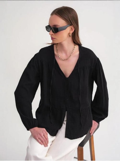 Camicetta a maniche lunghe dalla vestibilità relaxed con fiocco al collo mixray - Kiabi Camicetta a maniche lunghe dalla vestibilità relaxed con fiocco al collo mixray - Kiabi