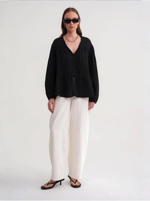 Camicetta a maniche lunghe dalla vestibilità relaxed con fiocco al collo mixray - Kiabi Camicetta a maniche lunghe dalla vestibilità relaxed con fiocco al collo mixray - Kiabi