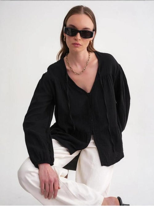 Camicetta a maniche lunghe dalla vestibilità relaxed con fiocco al collo mixray - Kiabi Camicetta a maniche lunghe dalla vestibilità relaxed con fiocco al collo mixray - Kiabi