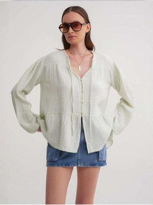 Camicetta a maniche lunghe dalla vestibilità relaxed con fiocco al collo mixray - Kiabi Camicetta a maniche lunghe dalla vestibilità relaxed con fiocco al collo mixray - Kiabi