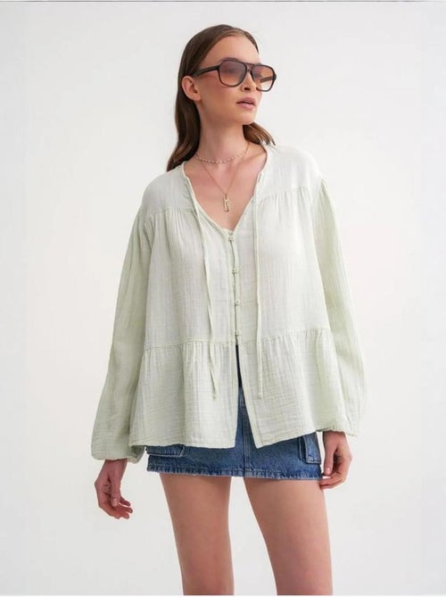 Camicetta a maniche lunghe dalla vestibilità relaxed con fiocco al collo mixray - Kiabi Camicetta a maniche lunghe dalla vestibilità relaxed con fiocco al collo mixray - Kiabi