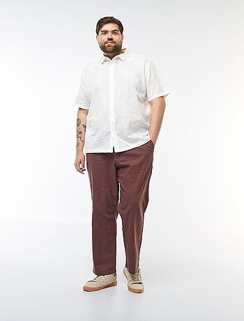 Camicia a maniche corte con ricami floreali all over