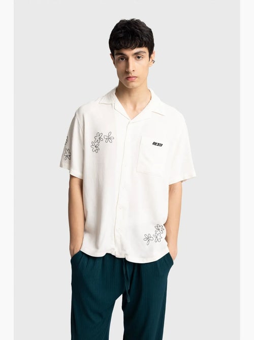 Camicia a maniche corte ricamata in popeline di cotone giesto - Kiabi Camicia a maniche corte ricamata in popeline di cotone giesto - Kiabi