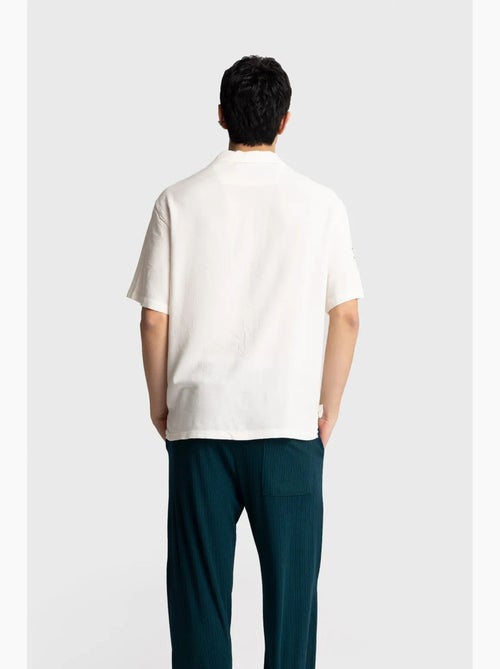 Camicia a maniche corte ricamata in popeline di cotone giesto - Kiabi Camicia a maniche corte ricamata in popeline di cotone giesto - Kiabi