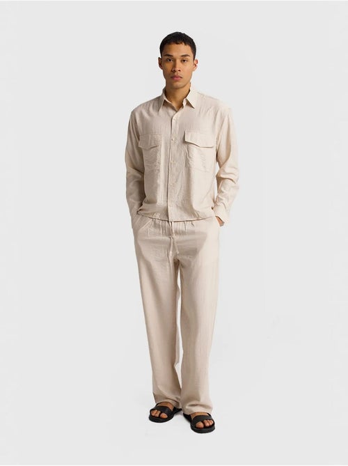 Camicia a maniche lunghe con abbottonatura e tasca giesto - Kiabi Camicia a maniche lunghe con abbottonatura e tasca giesto - Kiabi