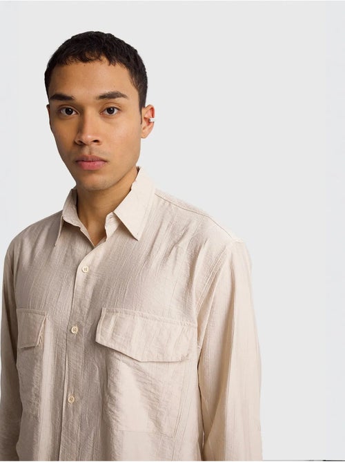 Camicia a maniche lunghe con abbottonatura e tasca giesto - Kiabi Camicia a maniche lunghe con abbottonatura e tasca giesto - Kiabi