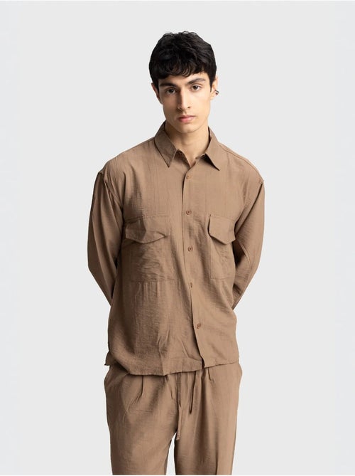 Camicia a maniche lunghe con abbottonatura e tasca giesto - Kiabi Camicia a maniche lunghe con abbottonatura e tasca giesto - Kiabi