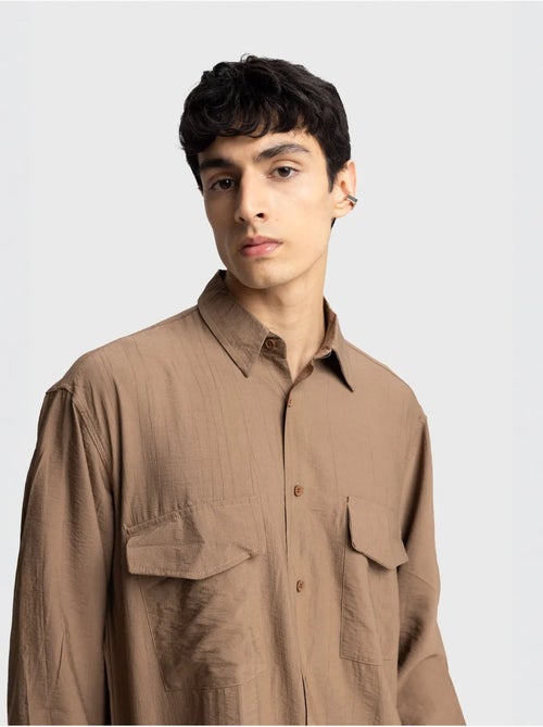 Camicia a maniche lunghe con abbottonatura e tasca giesto - Kiabi Camicia a maniche lunghe con abbottonatura e tasca giesto - Kiabi