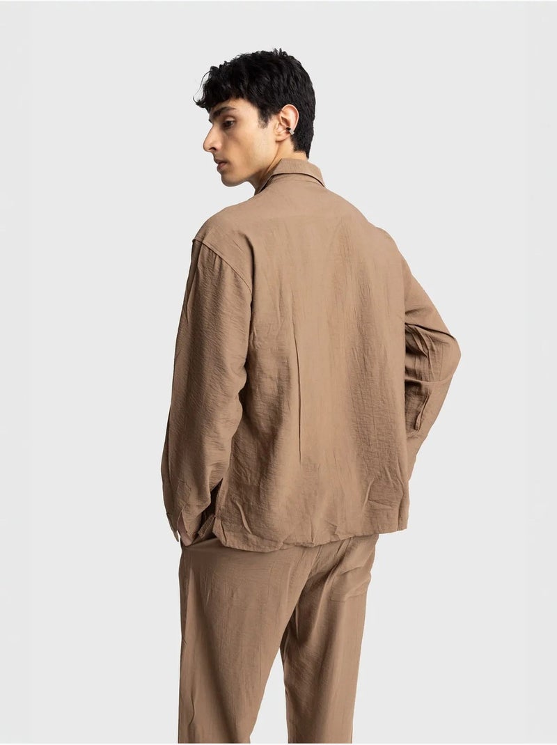 Camicia a maniche lunghe con abbottonatura e tasca giesto Grège - Kiabi