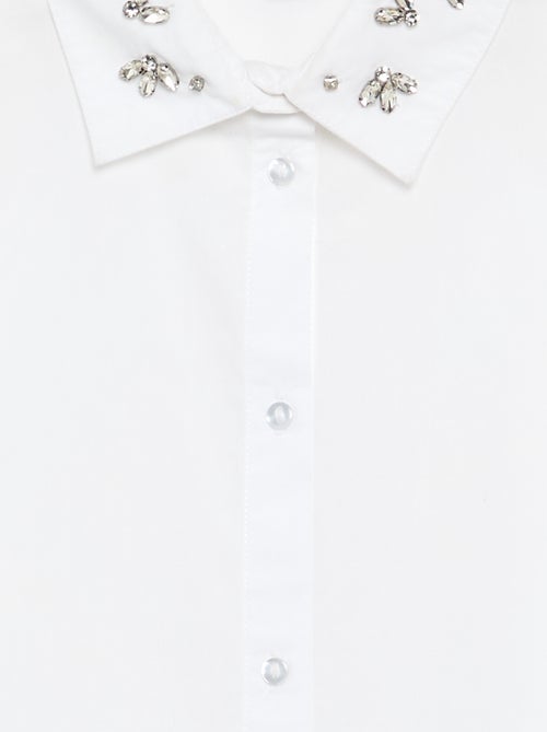 Camicia con finti gioielli sul colletto - Kiabi Camicia con finti gioielli sul colletto - Kiabi