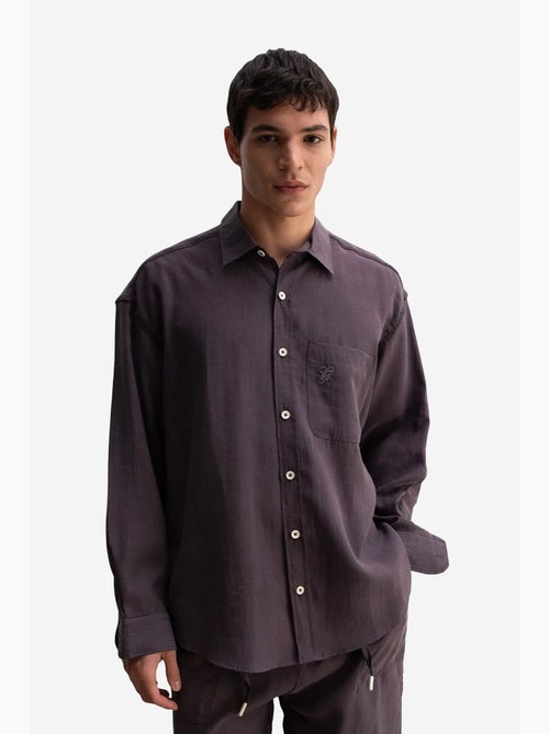 Camicia da uomo oversize a maniche lunghe con taschino giesto - Kiabi Camicia da uomo oversize a maniche lunghe con taschino giesto - Kiabi