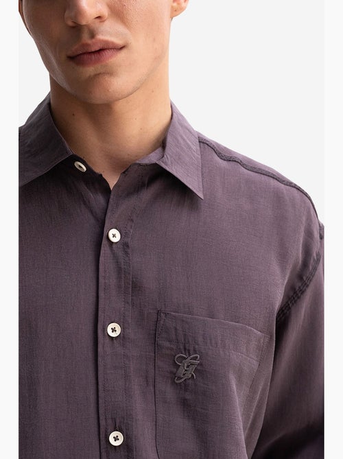 Camicia da uomo oversize a maniche lunghe con taschino giesto - Kiabi Camicia da uomo oversize a maniche lunghe con taschino giesto - Kiabi