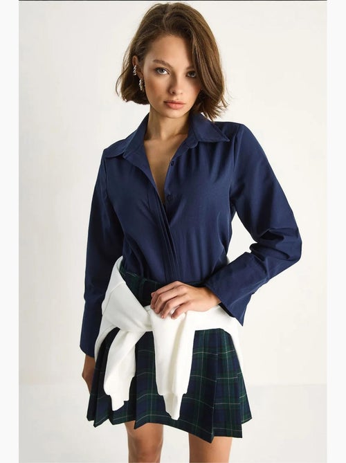 Camicia in popeline regular fit a maniche lunghe con abbottonatura lucci - Kiabi Camicia in popeline regular fit a maniche lunghe con abbottonatura lucci - Kiabi