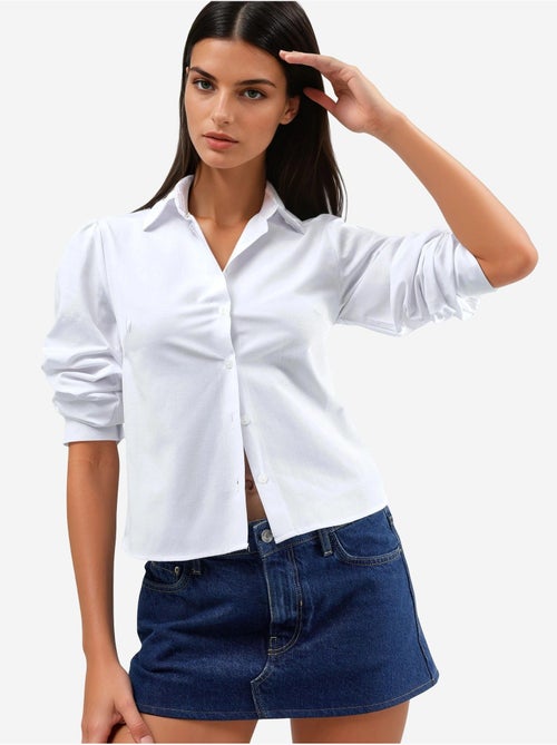 Camicia in popeline tinta unita con chiusura a bottoni busem - Kiabi Camicia in popeline tinta unita con chiusura a bottoni busem - Kiabi