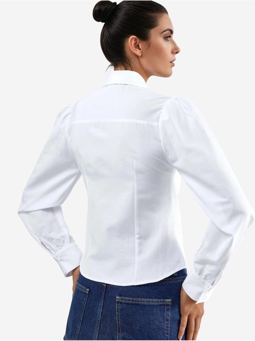 Camicia in popeline tinta unita con chiusura a bottoni busem - Kiabi Camicia in popeline tinta unita con chiusura a bottoni busem - Kiabi