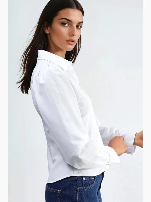 Camicia in popeline tinta unita con chiusura a bottoni busem - Kiabi Camicia in popeline tinta unita con chiusura a bottoni busem - Kiabi