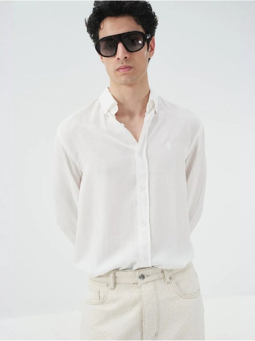 Camicia in tencel tinta unita con bottoni giesto - Kiabi Camicia in tencel tinta unita con bottoni giesto - Kiabi