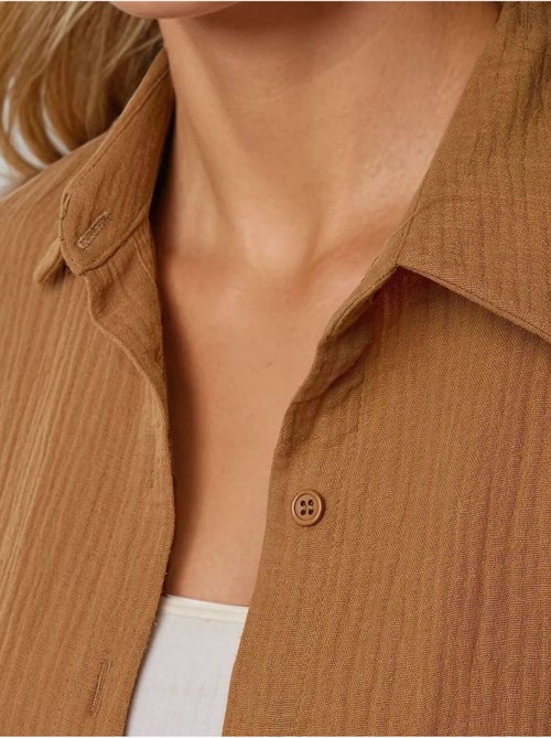 Camicia oversize in cotone con dettaglio tasca hiccup - Kiabi Camicia oversize in cotone con dettaglio tasca hiccup - Kiabi