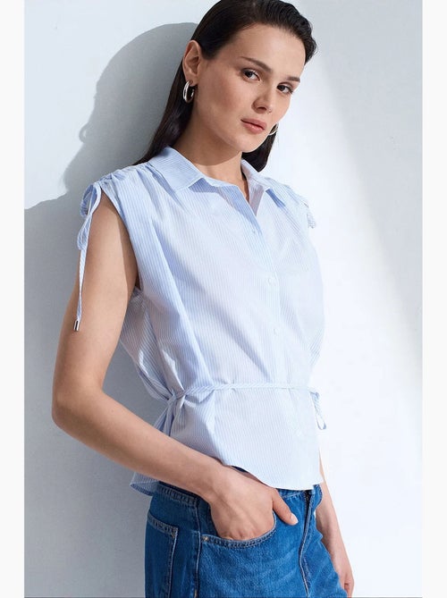 Camicia senza maniche in popeline di cotone a righe dilvin - Kiabi Camicia senza maniche in popeline di cotone a righe dilvin - Kiabi