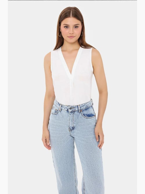 Camicia senza maniche semitrasparente con scollo a v hiccup - Kiabi Camicia senza maniche semitrasparente con scollo a v hiccup - Kiabi