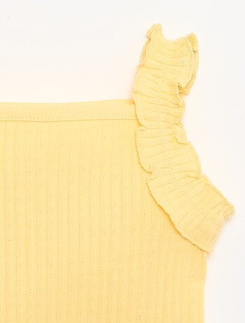 Canotta a costine a punto traforato con spalline a volant