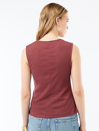 Canotta con apertura con bottoni dorati martellati