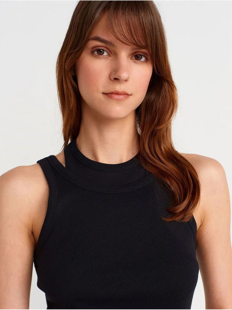 Canotta crop a coste in cotone dilvin Nero - Kiabi