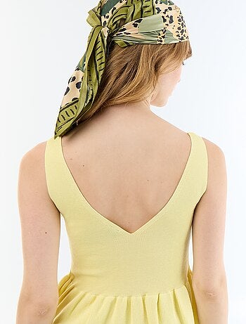 Canotta peplum in maglia a costine