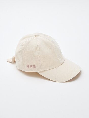 Cappellino con fiocco fantasia alla base