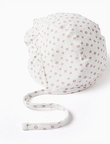 Cappellino in cotone con motivo floreale e laccetti