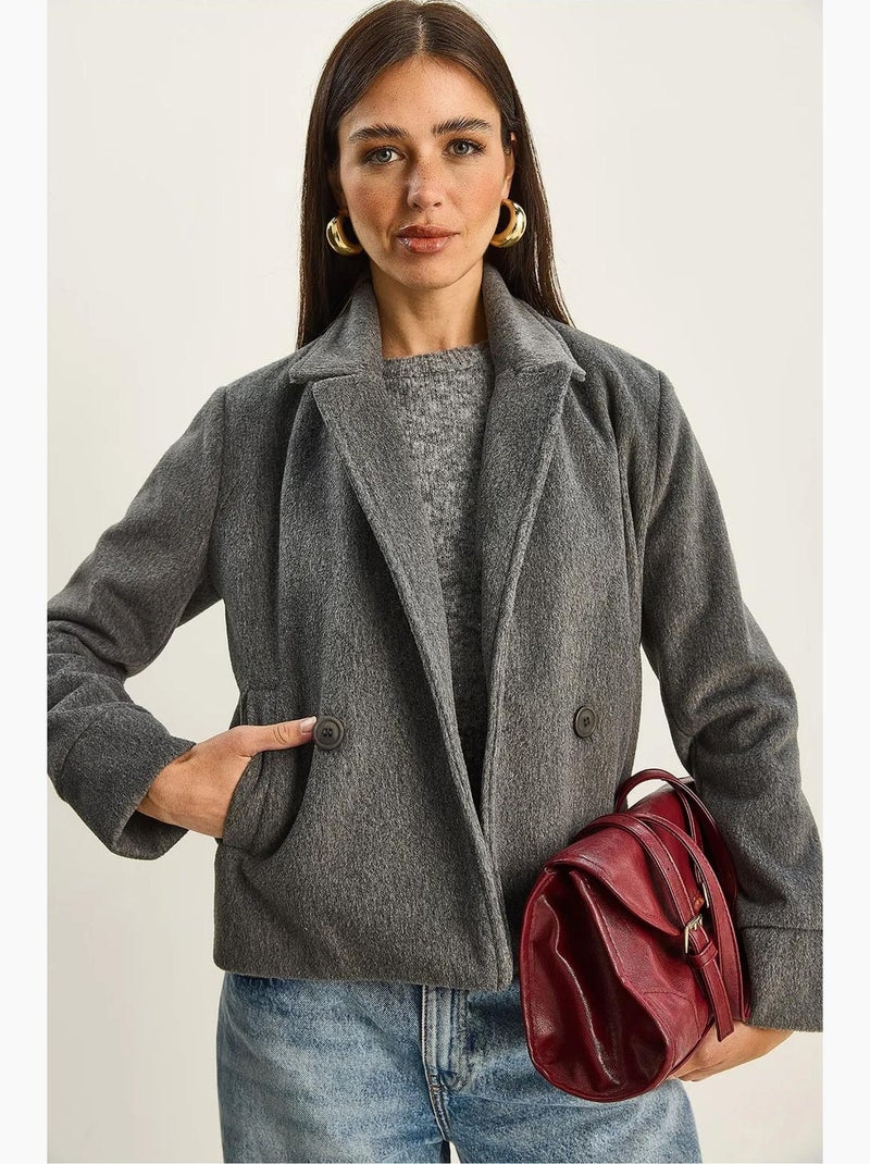 Cappotto in peluche con bottoni e tasche lucci Grigio nero - Kiabi