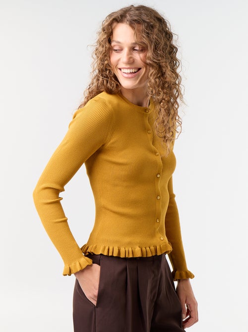 Cardigan a costine tinta unita con finiture a volant - Kiabi Cardigan a costine tinta unita con finiture a volant - Kiabi