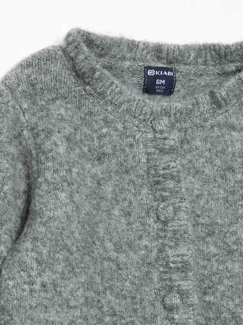 Cardigan a maniche lunghe con volant - Kiabi Cardigan a maniche lunghe con volant - Kiabi