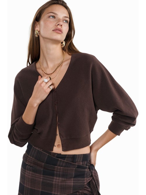 Cardigan corto a coste con scollo a v busem - Kiabi Cardigan corto a coste con scollo a v busem - Kiabi