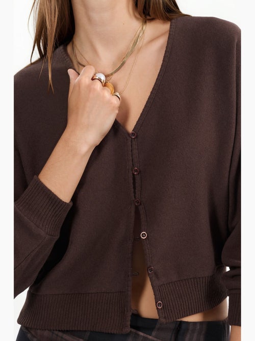 Cardigan corto a coste con scollo a v busem - Kiabi Cardigan corto a coste con scollo a v busem - Kiabi