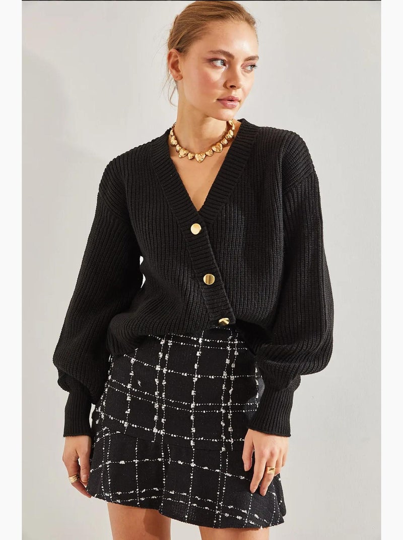 Cardigan corto in maglia a coste con scollo a v e bottoni color oro lucci Nero - Kiabi