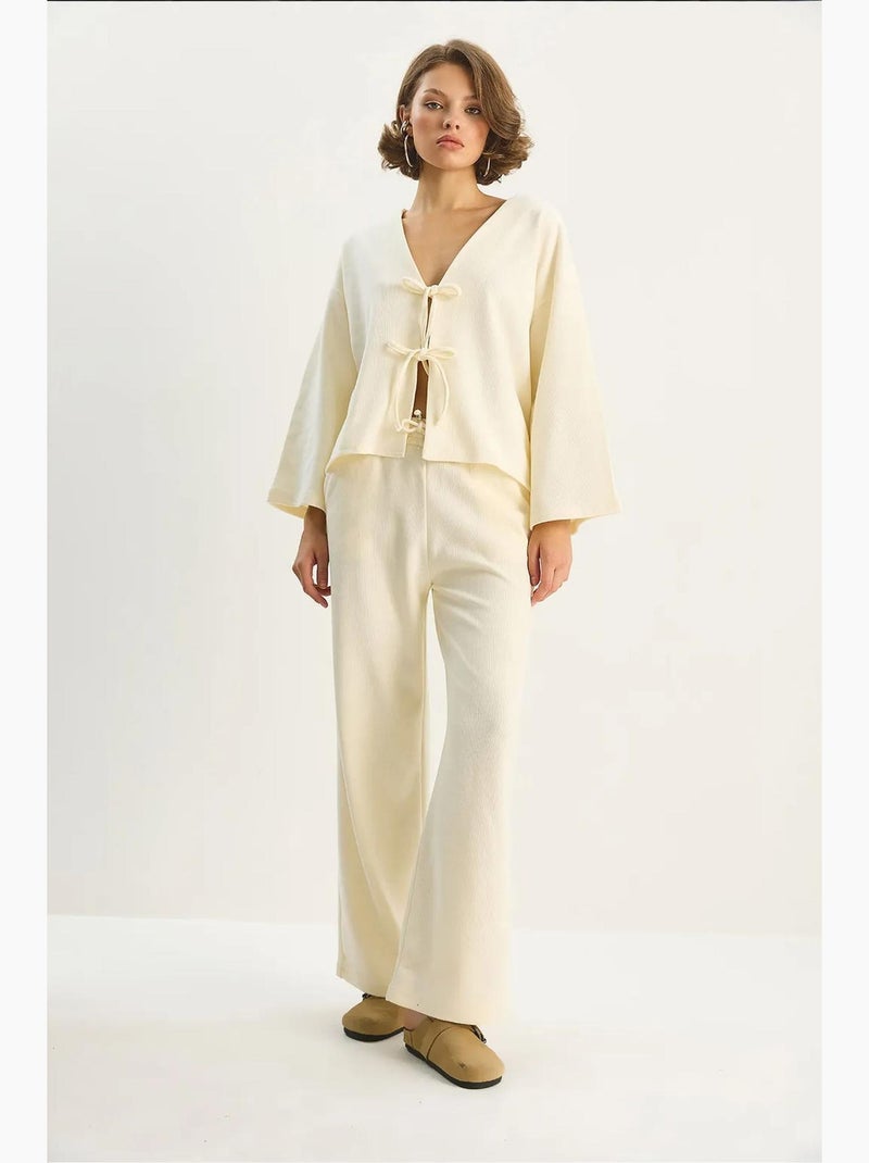 Cardigan in maglia con scollo a v e set di pantaloni a gamba ampia lucci Beige chiaro - Kiabi