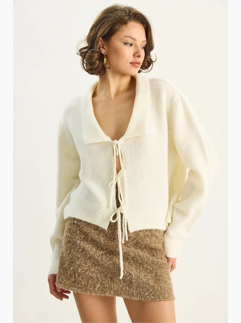 Cardigan oversize a costine con scollo a v e chiusura con laccetto lucci Sabbia - Kiabi