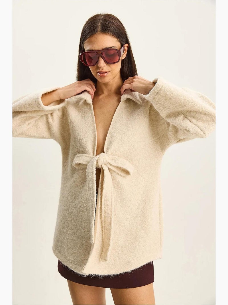 Cardigan oversize testurizzato con scollo a v e chiusura con laccetto lucci Avorio - Kiabi