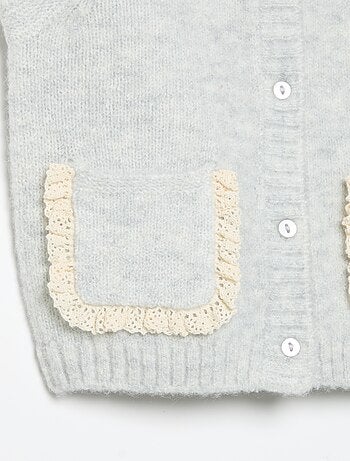 Cardigan senza maniche con tasche ricamate