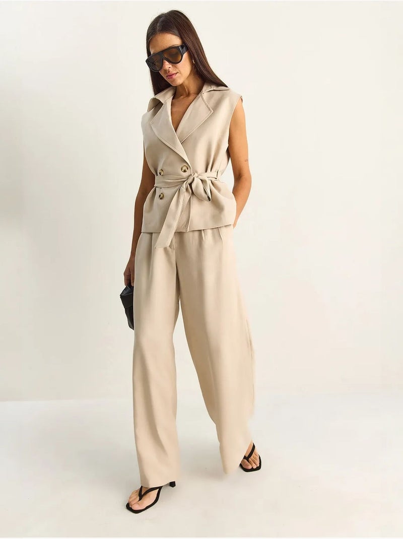 Completo coordinato a vita alta con gamba larga e collo a scialle lucci Beige argilla - Kiabi