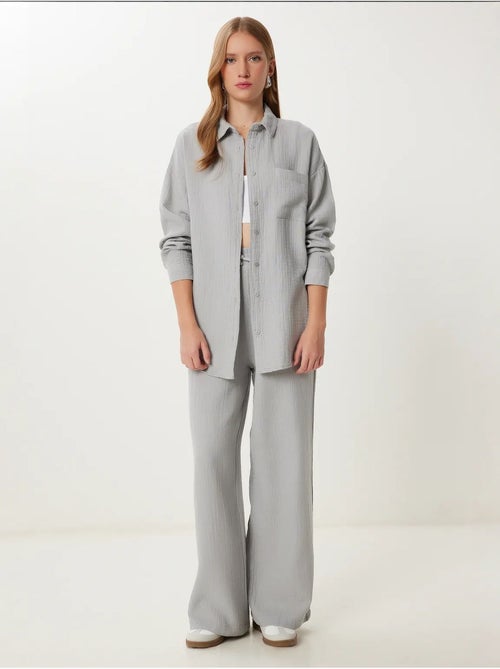 Completo coordinato due pezzi a vita alta con gamba ampia e collo a camicia istanbul - Kiabi Completo coordinato due pezzi a vita alta con gamba ampia e collo a camicia istanbul - Kiabi