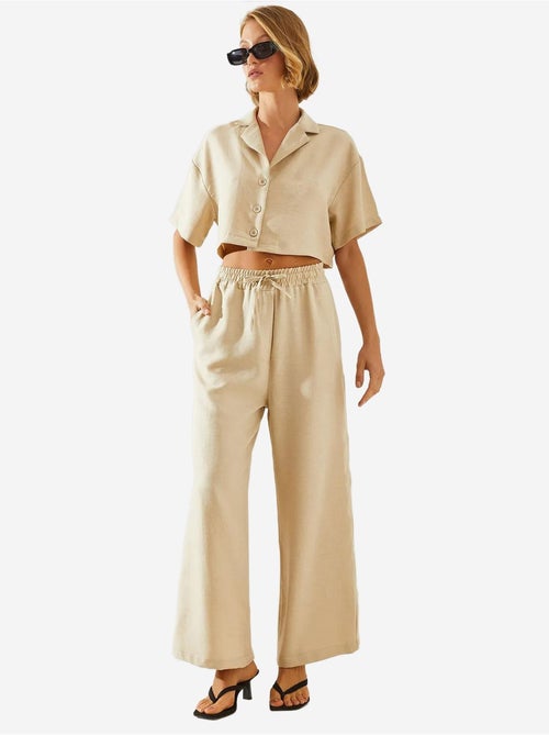 Completo due pezzi con colletto della giacca e pantaloni con bottoni e tasche lucci - Kiabi
