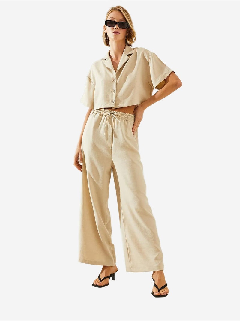 Completo due pezzi con colletto della giacca e pantaloni con bottoni e tasche lucci Beige argilla - Kiabi