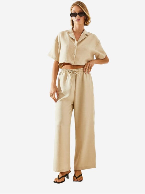 Completo due pezzi con colletto della giacca e pantaloni con bottoni e tasche lucci - Kiabi