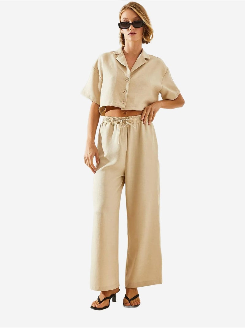 Completo due pezzi con colletto della giacca e pantaloni con bottoni e tasche lucci Beige argilla - Kiabi