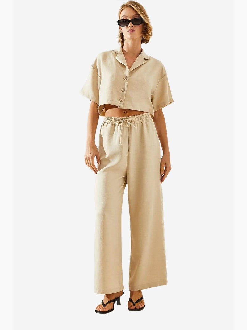 Completo due pezzi con colletto della giacca e pantaloni con bottoni e tasche lucci Beige argilla - Kiabi